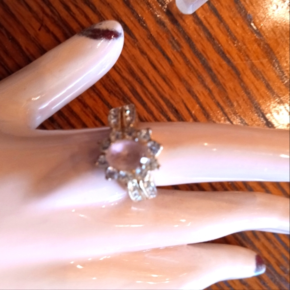 Gold tone light pink with diamond style ring